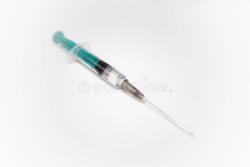 Syringe with needle on white background