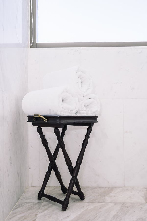 White bath towel on table stock photo. Image of home 147339346