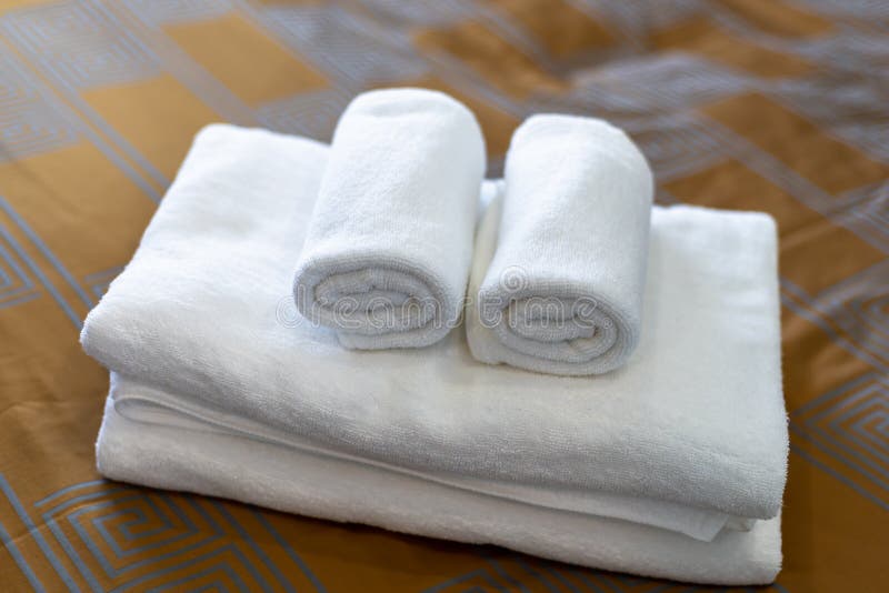 White Bath Towels on Bed in Hotel Stock Photo Image of fabric