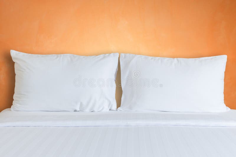 White Bedding Sheets And Pillow In Hotel Room
