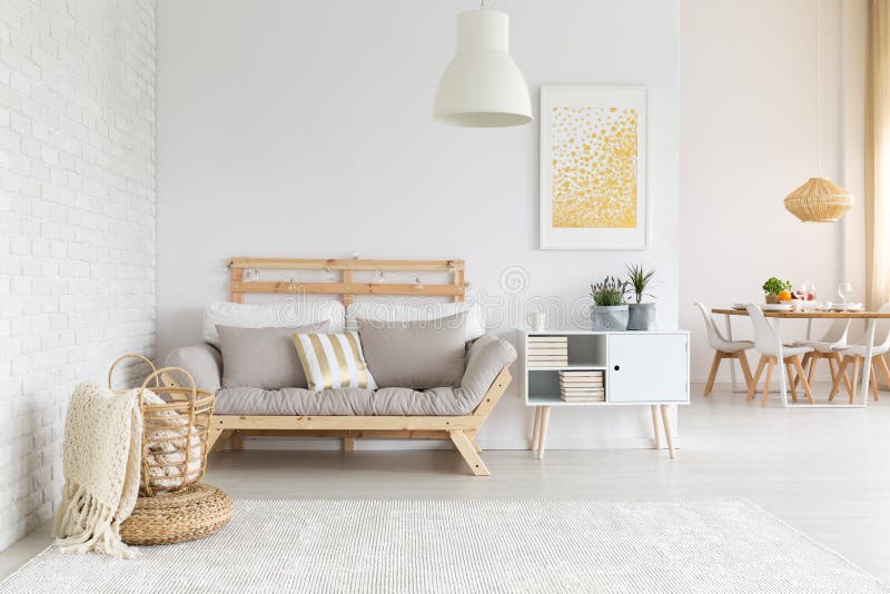 White, beige and gold furniture and decorations in living room. White, beige and gold furniture and decorations in living room