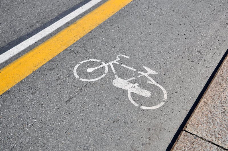 White bicycle sign painted on a street