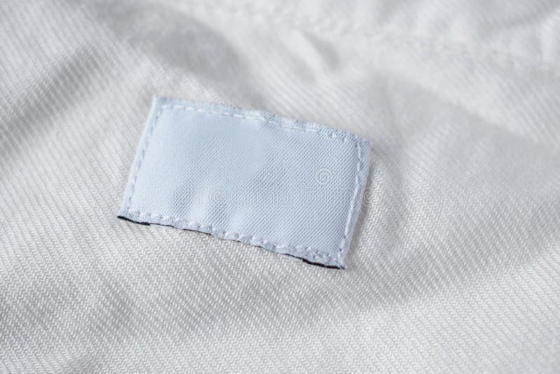 White Blank Laundry Care Clothes Label on Cotton Shirt Stock Photo ...