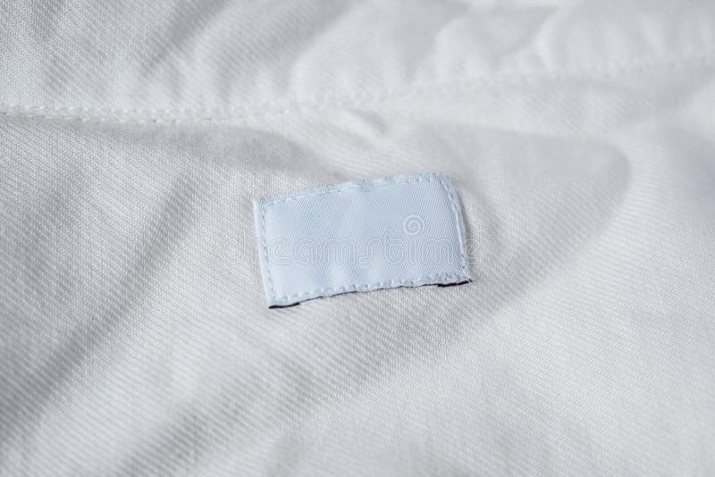 White Blank Laundry Care Clothes Label on Cotton Shirt Stock Image ...