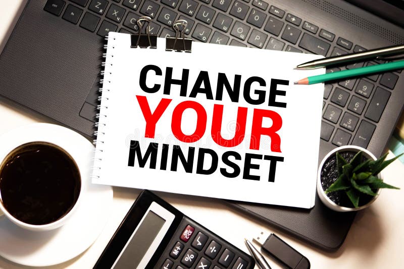 White blank notepad on office wooden table Change your mindset concept royalty free stock images
