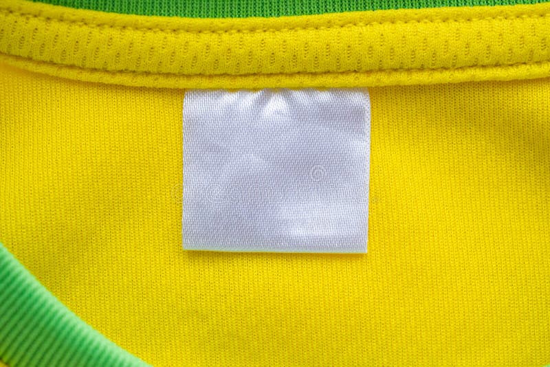 White Blank Textile Clothes Label on Yellow Sport Clothing Fabric ...