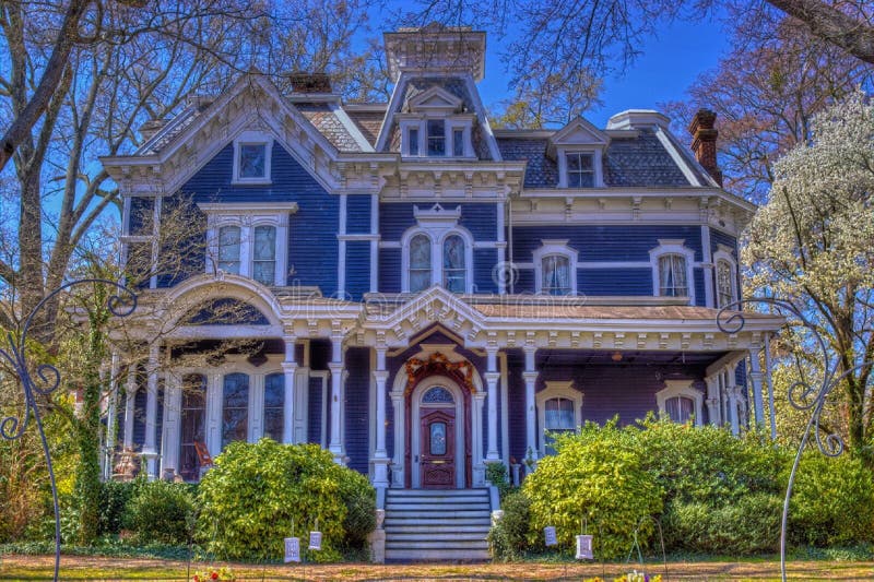 White Blue and Brown Painted House Near Green Plants stock image White Blue and Brown Painted House Near Green Plants stock image