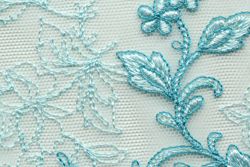 White and blue flower lace material texture macro shot