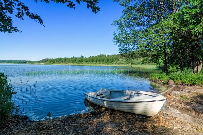 White boat on Norwegian lake coast