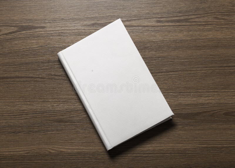 White Book on Brown Wooden Table · Free Stock Photo