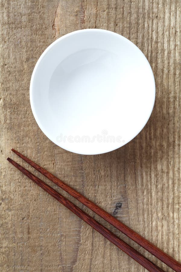 White bowl and wood chopsticks