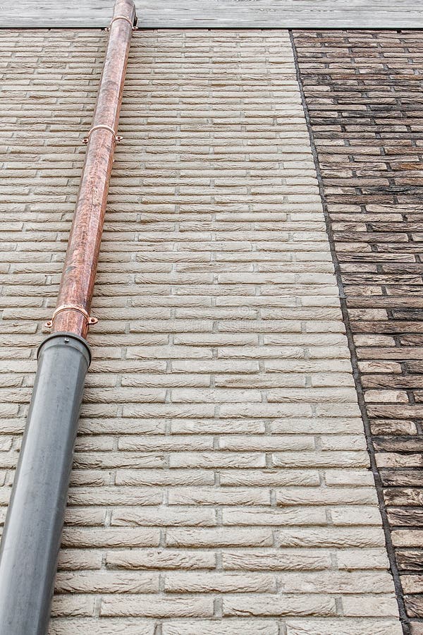 White Brick Wall and Brown Brick Wall with Gray Wooden Frontal Board