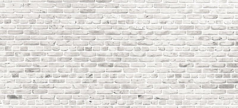 White brick wall. Simple grungy white brick wall with light gray shades pattern surface texture background in wide panorama format