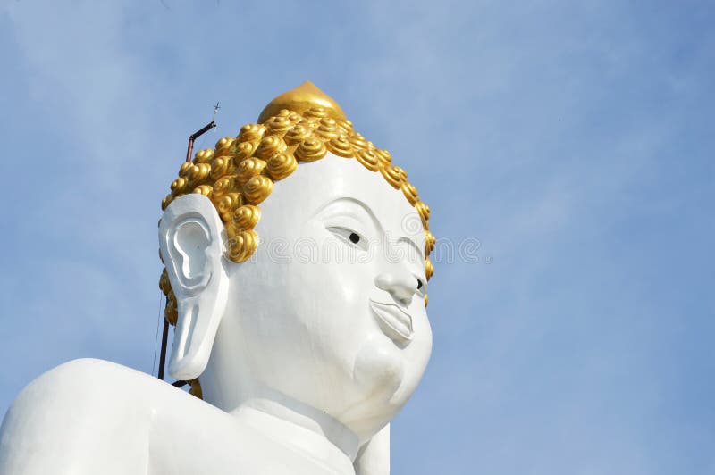White Buddha image in Wat Phrathat Doi Kham ancient temple in Thailand stock image White Buddha image in Wat Phrathat Doi Kham ancient temple in Thailand stock image