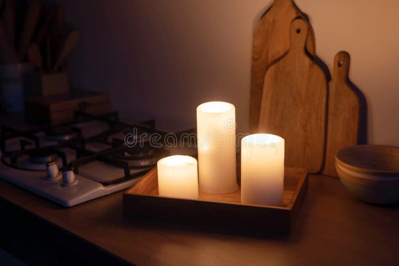 https://thumbs.dreamstime.com/b/white-burning-candles-kitchen-table-evening-light-fan-power-outage-261073364.jpg