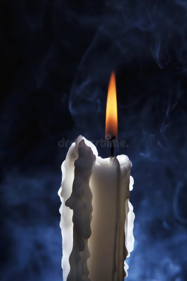 White candle burning with smoke royalty free stock photos White candle burning with smoke royalty free stock photos