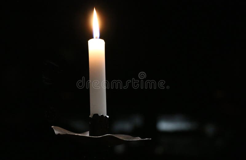 A Candle That Burns Twice As Bright A White Candle Burns Bright In The Darkness. Stock Photo - Image of
