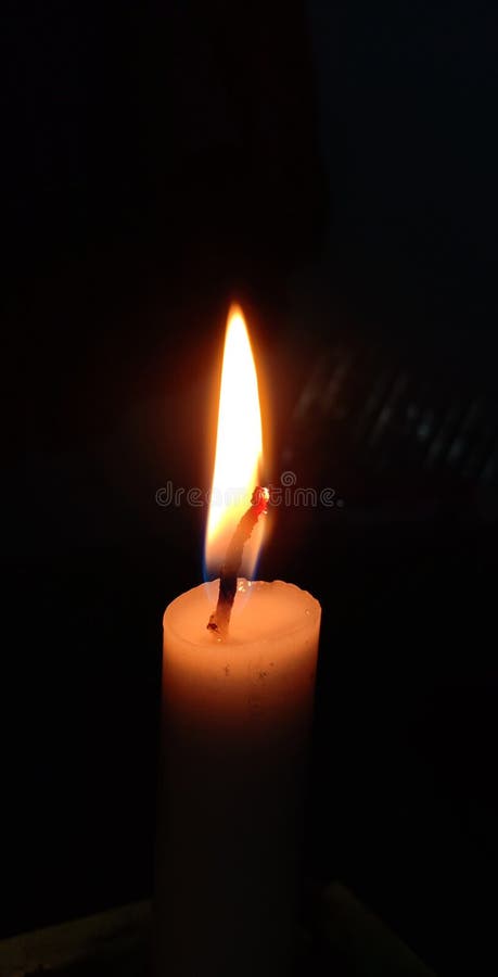 Man Holding Lit Match Near Burning Candles While Sitting In Kitchen During Power  Outage Stock Photo, Picture and Royalty Free Image. Image 194083339.