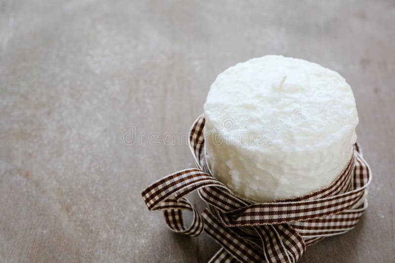 White Candle Wrapped In Christmas Ribbon Stock Photo Image of board