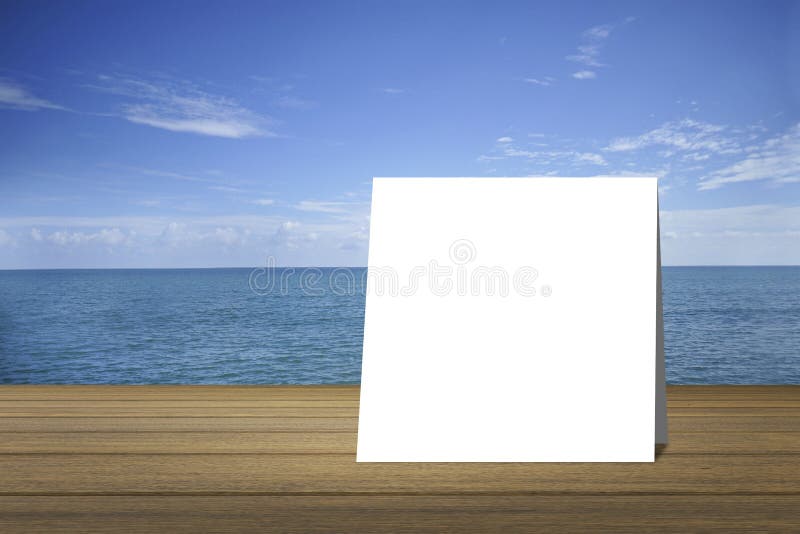 White card put on wood table and beautiful peace sea in background. product display template. Business presentation.clipping path royalty free illustration White card put on wood table and beautiful peace sea in background. product display template. Business presentation.clipping path royalty free illustration