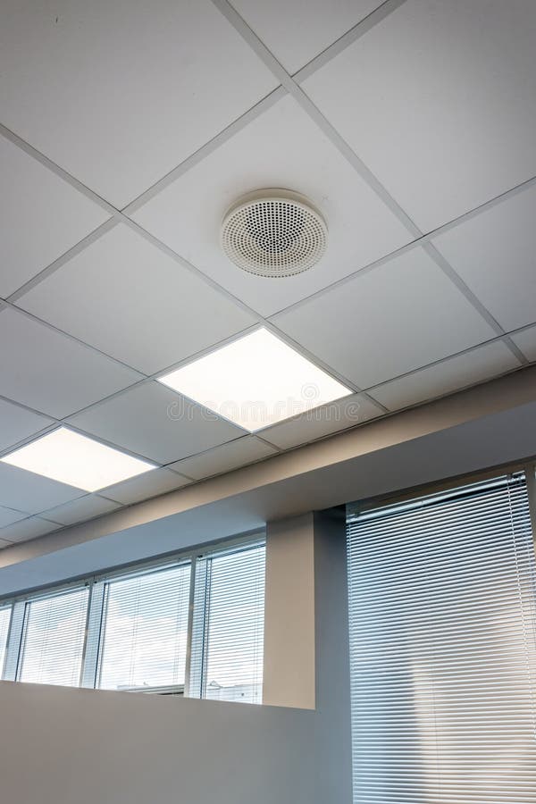 White ceiling with modern lighting in office
