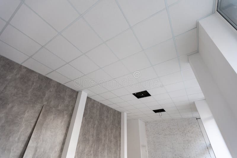 White ceiling in the office. White ceiling can reflect light well. The right light at work. Abstract empty white royalty free stock image