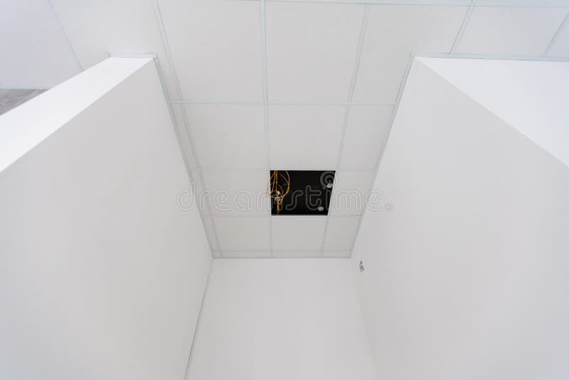 White ceiling in the office. White ceiling can reflect light well. The right light at work. Abstract empty white royalty free stock photography