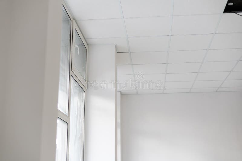 White ceiling in the office. White ceiling can reflect light well. The right light at work. Abstract empty white royalty free stock photo