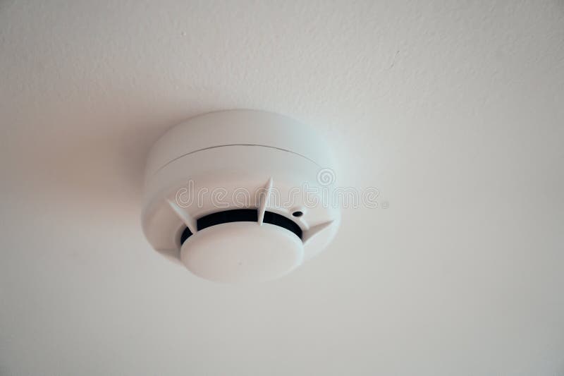 White Ceiling Smoke Detector for Fire Safety stock image