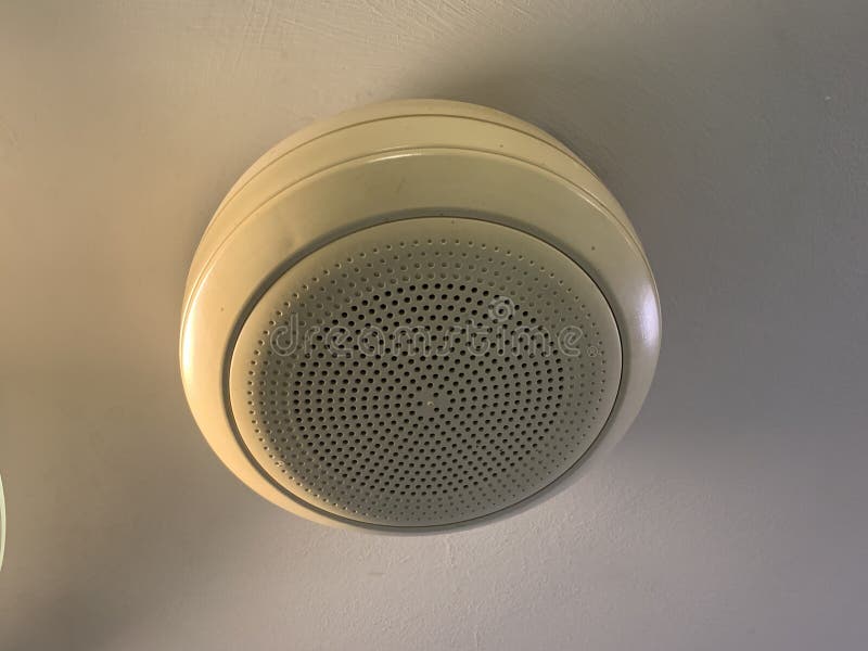 White ceiling speaker with white ceiling royalty free stock photo