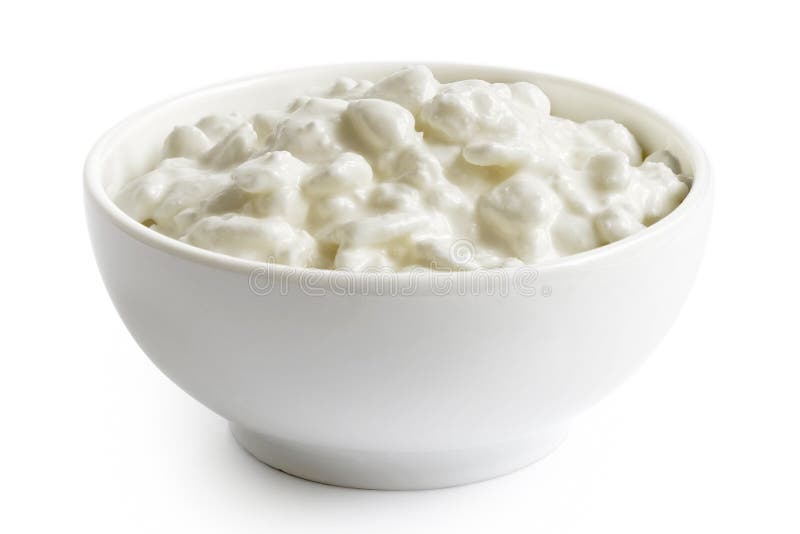 White ceramic bowl of chunky cottage cheese isolated on white