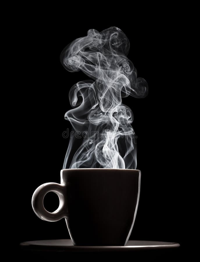 White ceramic cup of fresh steaming fragrant aromatic morning hot coffee over black background. Smoke from hot coffee