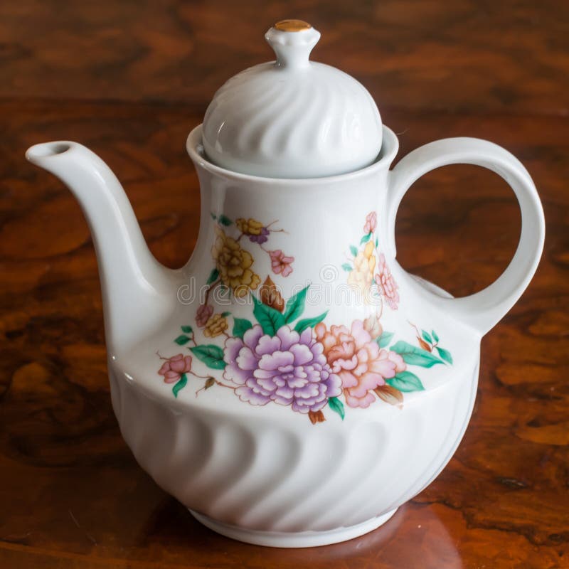 A White Ceramic Teapot with Floral Decoration Stock Image Image of