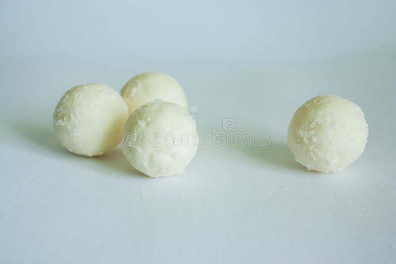 White chocolate candy balls with coconut stock images White chocolate candy balls with coconut stock images