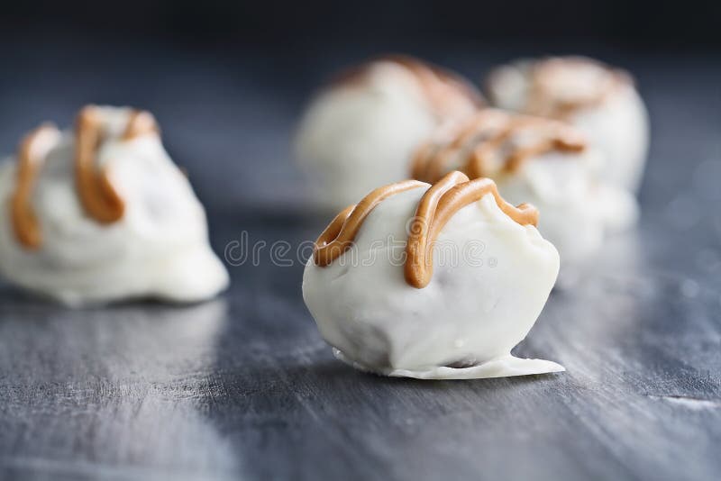 White Chocolate Truffle Candies Drizzled with Peanut Butter