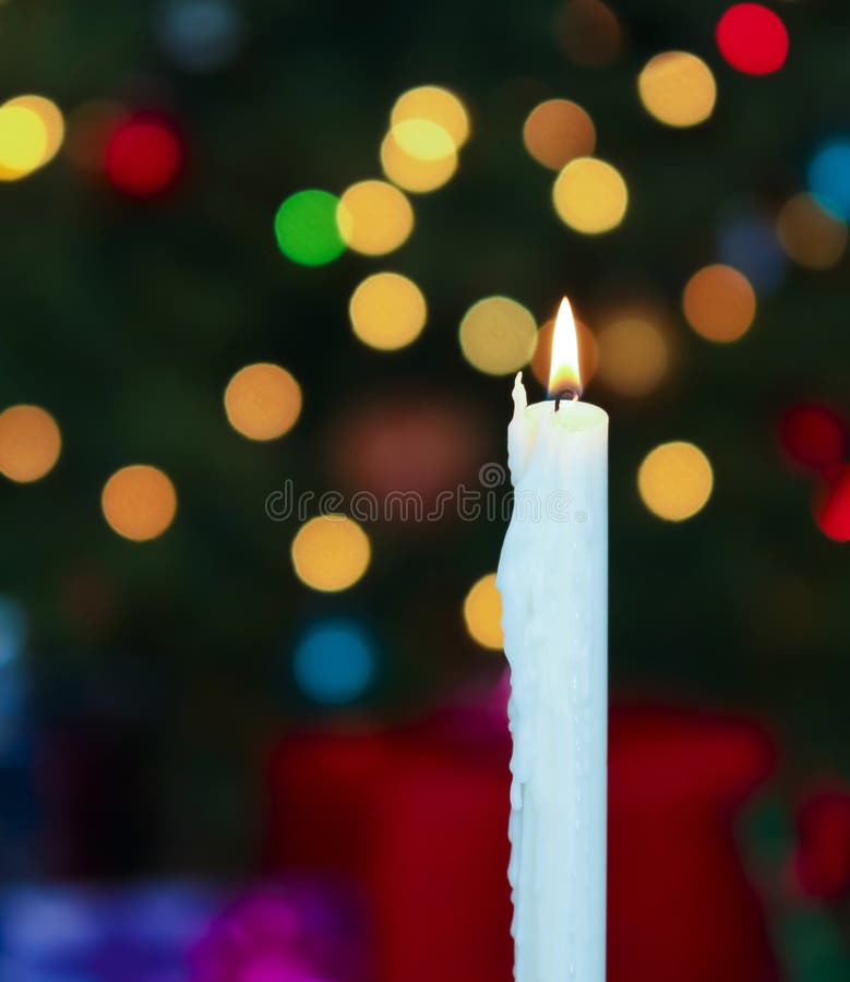 A White Christmas Candle with Blurred Lights Stock Photo Image of