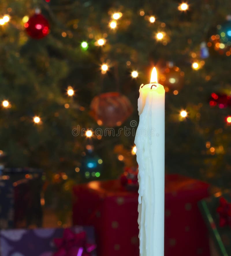 A White Christmas Candle with Blurred Lights Stock Photo Image of