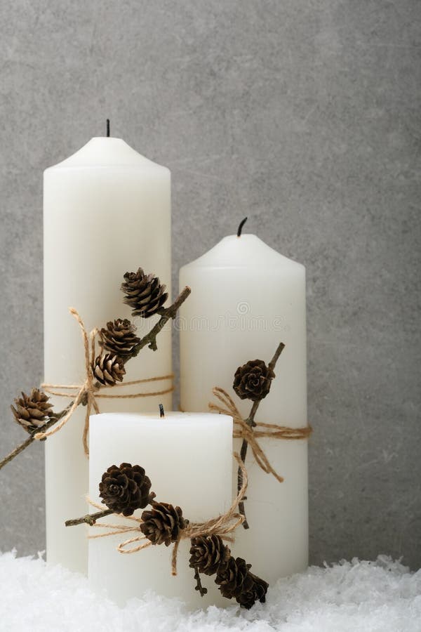 White Candles with Christmas Balls and Decor Deer on the Boards Stock