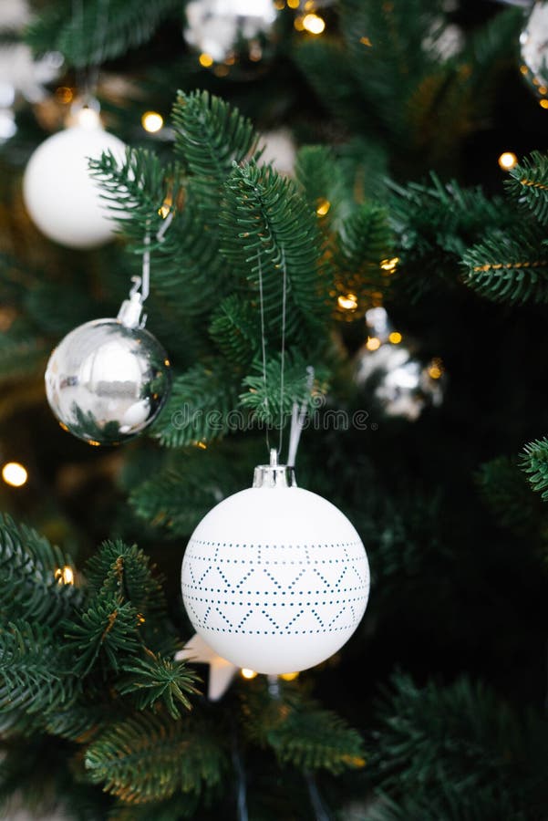 White Christmas toys on the Christmas tree close-up