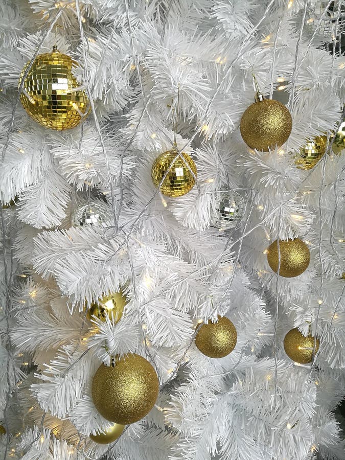 White Christmas tree decoration, variety of golden hanging ball ornaments with white tinsel