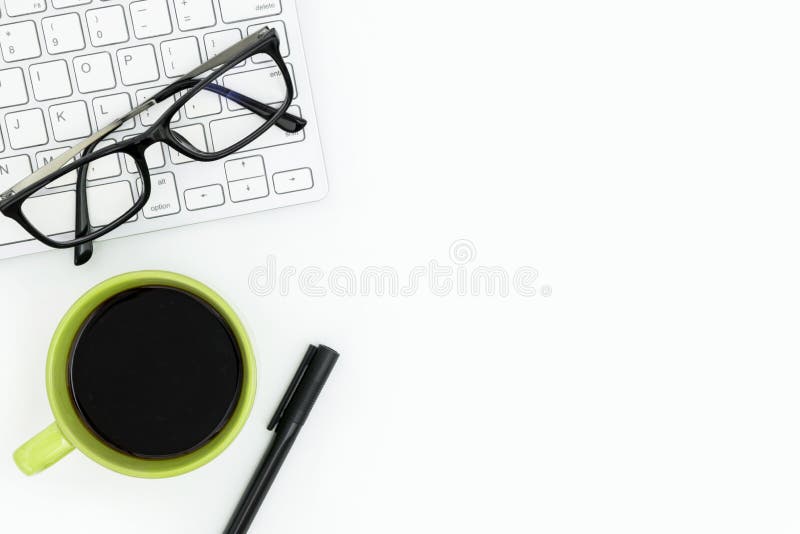 White Clean Office Desk Table with Computer Keyboard, Coffee Cup and