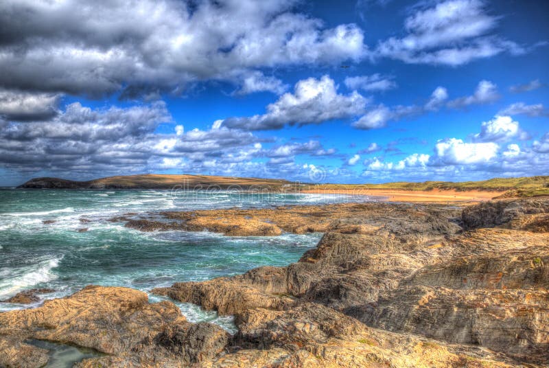 White clouds and blue sky Constantine Bay Cornwall England UK on the Cornish north coast in colourful HDR
