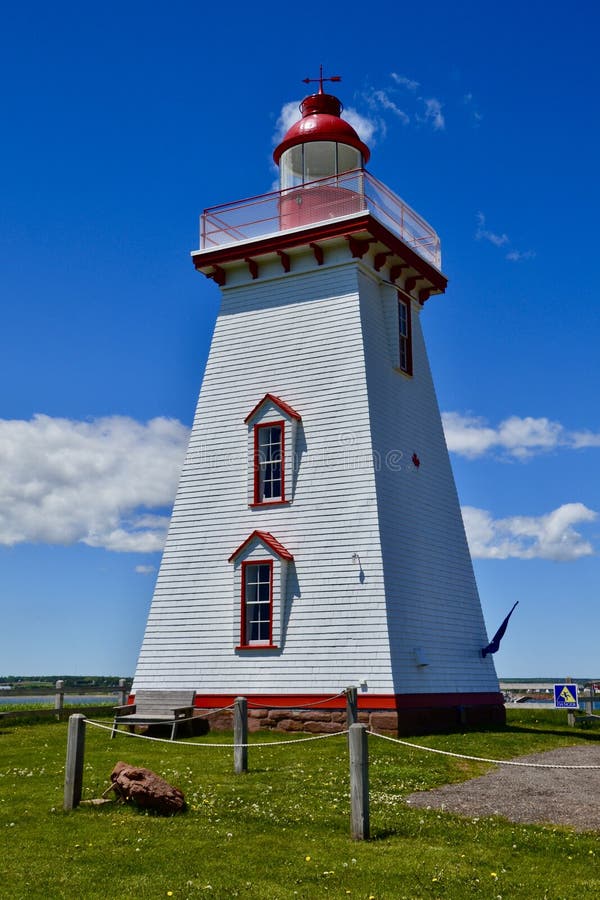 White clouds passing by Souris Lighthouse stock images