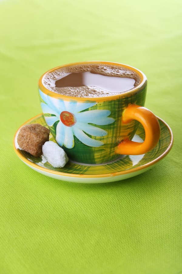 White coffee in green floral design cup