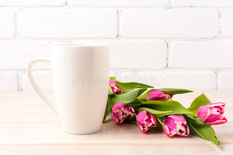 White coffee latte mug mockup with rich pink tulips bouquet royalty free stock photos White coffee latte mug mockup with rich pink tulips bouquet royalty free stock photos