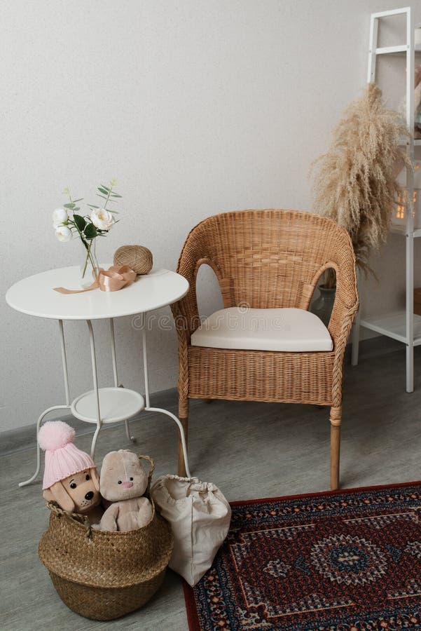 Bright interior of the room. White coffee table, chair and children\ s toys