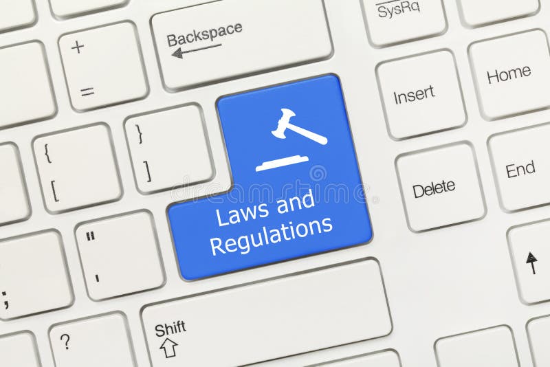 White conceptual keyboard - Laws and Regulations blue key with gavel symbol. Close-up view on white conceptual keyboard - Laws and Regulations blue key with royalty free stock image White conceptual keyboard - Laws and Regulations blue key with gavel symbol. Close-up view on white conceptual keyboard - Laws and Regulations blue key with royalty free stock image