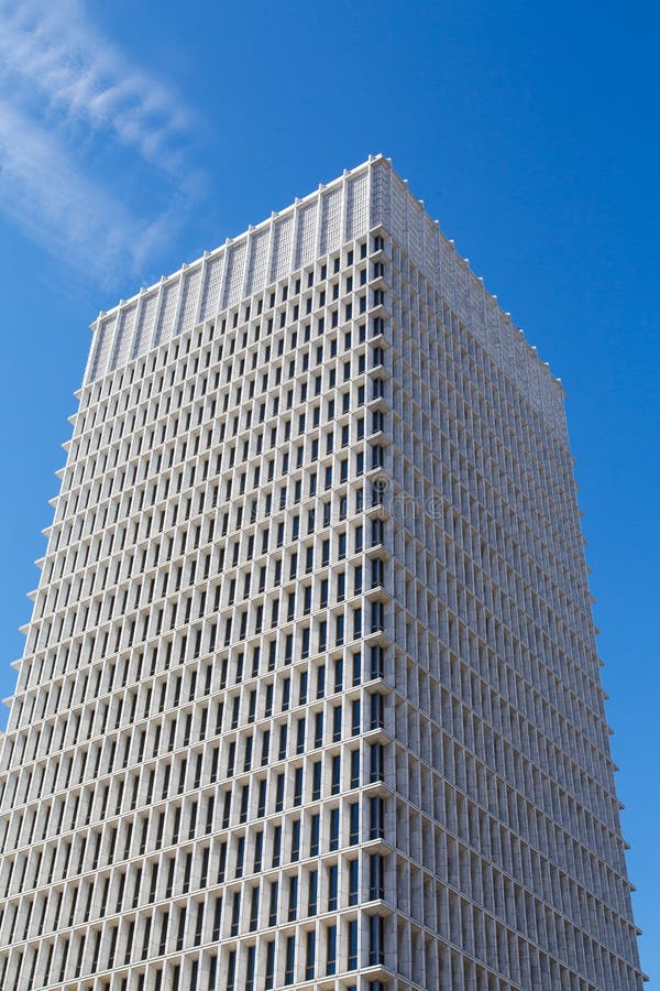 White Concrete Tower with Narrow Blue Windows