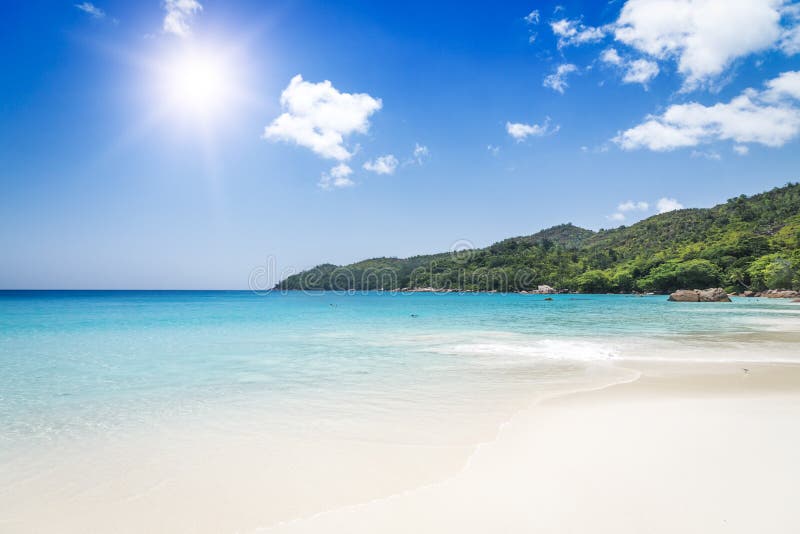 White coral beach sand and azure ocean. Seychelles islands. royalty free stock images