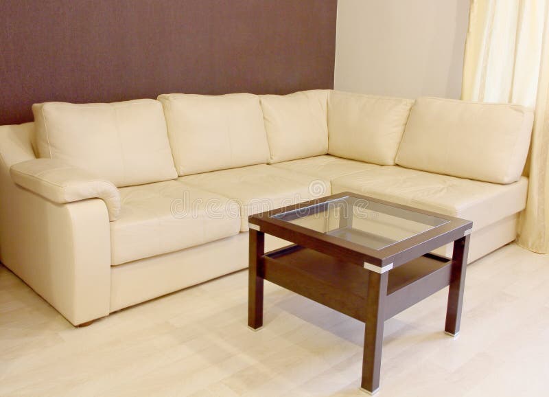 White Corner Leather Sofa and Coffee Table. Stock Photo Image of